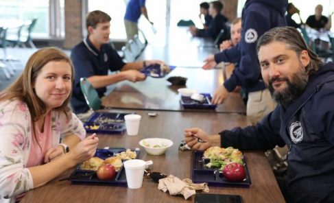 Akenberger (right) and his wife, Stephanie (left) enjoy eating lunch with the students.
