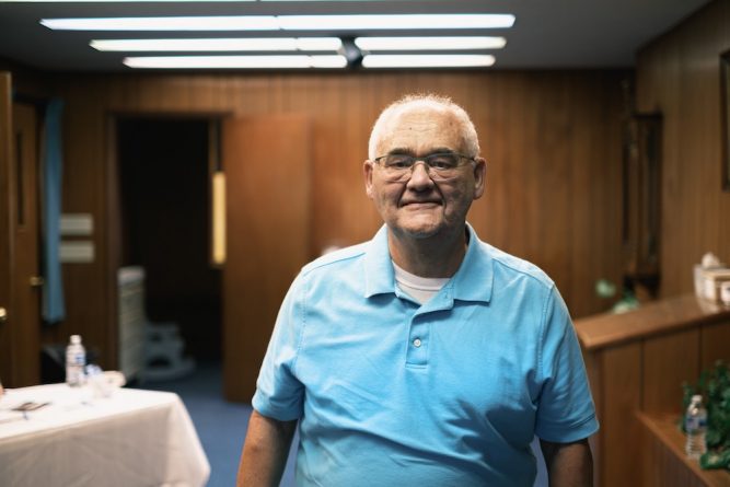 Bob is one of the elders of the church. Tonight he's the welcoming greeter. It's a small church & everyone's chipping in.